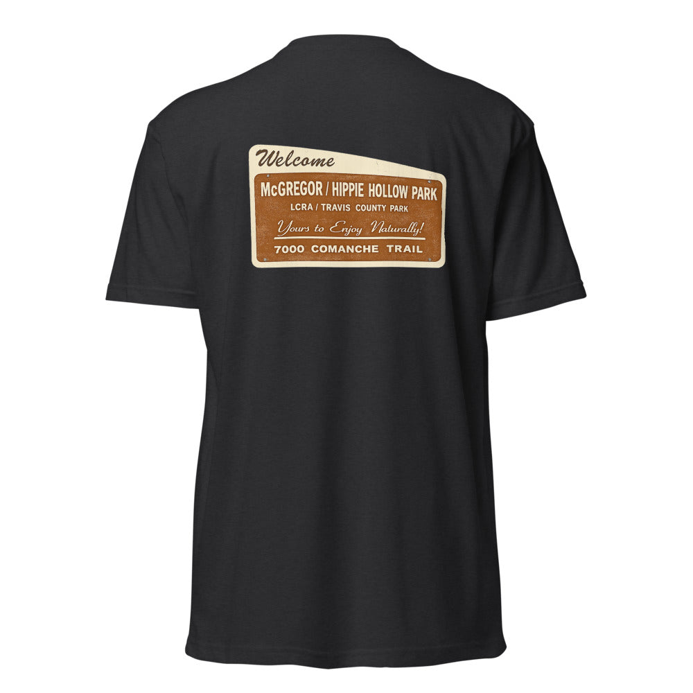 Hippie Hollow Tee — Black, back sign